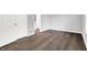 A cozy bedroom is shown with hardwood floors and entry to the bathroom at 4007 Knollwood Ave, Franklin, IN 46131