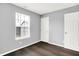 Bedroom featuring a window and a closet door at 4007 Knollwood Ave, Franklin, IN 46131