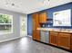 Bright kitchen features stainless steel appliances, wood cabinets, and a view to the backyard at 4007 Knollwood Ave, Franklin, IN 46131