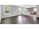 Inviting living room featuring laminate floors, neutral walls, and abundant natural light at 4007 Knollwood Ave, Franklin, IN 46131