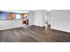 Open-concept living area featuring wood-look floors and a seamless transition to the kitchen at 4007 Knollwood Ave, Franklin, IN 46131