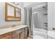Traditional bathroom with a vanity, cabinet, and a combination shower and tub, offering complete functionality at 407 Woodland E Dr, Greenfield, IN 46140
