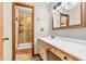 Bright bathroom featuring a well-lit vanity area and a modern walk-in shower, perfect for everyday use at 407 Woodland E Dr, Greenfield, IN 46140