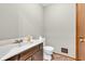 Comfortable half bathroom with a sink and toilet, designed for convenience and practicality at 407 Woodland E Dr, Greenfield, IN 46140