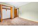 Well-lit bedroom includes a closet, offering ample storage for a clean and organized living space at 407 Woodland E Dr, Greenfield, IN 46140