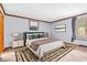 Calm bedroom featuring a plush bed, stylish decor, and lots of natural light at 407 Woodland E Dr, Greenfield, IN 46140