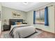 Cozy bedroom with a comfortable bed, dark furniture, and plenty of natural light at 407 Woodland E Dr, Greenfield, IN 46140