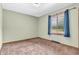 Cozy bedroom with plush carpet and a sunny window, creating a serene and inviting atmosphere at 407 Woodland E Dr, Greenfield, IN 46140