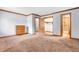 Spacious bedroom features light walls, closet and attached bathroom offering ample space and convenience at 407 Woodland E Dr, Greenfield, IN 46140