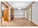 Dining room filled with natural light, featuring carpet, and traditional trim at 407 Woodland E Dr, Greenfield, IN 46140