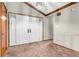 Foyer with neutral walls, plush carpet, and attractive double doors at 407 Woodland E Dr, Greenfield, IN 46140