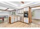 Beautiful kitchen featuring a breakfast bar, stainless steel appliances, and wood cabinets at 407 Woodland E Dr, Greenfield, IN 46140
