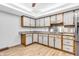 Charming kitchen with ample cabinet space, stainless steel appliances, and updated flooring at 407 Woodland E Dr, Greenfield, IN 46140