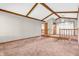 Large living area featuring a step down, exposed beam ceilings, and neutral walls at 407 Woodland E Dr, Greenfield, IN 46140
