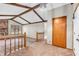 Bright living room showcases the vaulted ceiling, brick fireplace, and open floor plan at 407 Woodland E Dr, Greenfield, IN 46140