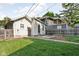 Relaxing backyard with green grass, patio, and detached garage is great for entertaining and outdoor living at 4137 Rookwood Ave, Indianapolis, IN 46208