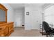 Bright bedroom featuring a desk, chair, hardwood dresser, and neutral carpet flooring at 4137 Rookwood Ave, Indianapolis, IN 46208