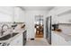 Bright kitchen featuring white cabinets, granite countertops, stainless steel appliances, and tile flooring at 4137 Rookwood Ave, Indianapolis, IN 46208