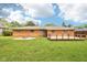Spacious backyard with a patio, and a well-maintained lawn, perfect for outdoor activities and relaxation at 418 Dunbar Dr, Indianapolis, IN 46229