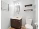 Cozy bathroom with vintage vanity, mirror, and lighting at 418 Dunbar Dr, Indianapolis, IN 46229