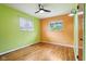 Bedroom boasts hardwood floors and a fan at 418 Dunbar Dr, Indianapolis, IN 46229