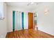Bright bedroom features wooden floors, a closet, and a window to let in natural light at 418 Dunbar Dr, Indianapolis, IN 46229