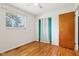 Bedroom with wood floors, closet, a window to let in light and a ceiling fan at 418 Dunbar Dr, Indianapolis, IN 46229