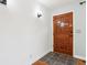 Warm and inviting entrance with tiled floors, and beautiful door at 418 Dunbar Dr, Indianapolis, IN 46229