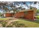 A brick ranch-style home featuring an inviting front exterior with well-maintained landscaping and an attached garage at 418 Dunbar Dr, Indianapolis, IN 46229