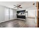 Living room with wood-look floors and windows looking into kitchen at 418 Dunbar Dr, Indianapolis, IN 46229