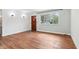Inviting living room with hardwood floors and natural light from a large window at 418 Dunbar Dr, Indianapolis, IN 46229
