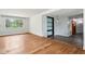 Open living area boasts hardwood floors with views to dining at 418 Dunbar Dr, Indianapolis, IN 46229
