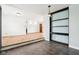 Open-concept living room with hardwood floors, view of the front door and natural lighting at 418 Dunbar Dr, Indianapolis, IN 46229