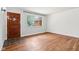 Comfortable living room with hardwood floors and large front door at 418 Dunbar Dr, Indianapolis, IN 46229