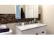 Bathroom featuring a new quartz vanity, a stylish mirror, and mosaic tile accents at 430 Heritage Dr, Danville, IN 46122
