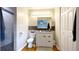 Updated bathroom with modern vanity, stylish mirror, and tiled shower; features hardwood floors at 430 Heritage Dr, Danville, IN 46122