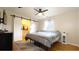 Bedroom with hardwood flooring, ceiling fan, a queen-size bed and ensuite bathroom access at 430 Heritage Dr, Danville, IN 46122
