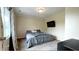 Cozy bedroom featuring a queen bed, carpeted floor, neutral walls, and ample natural light at 430 Heritage Dr, Danville, IN 46122