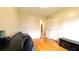 Bedroom with hardwood floors, an open closet, and a grey futon at 430 Heritage Dr, Danville, IN 46122