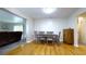 Bright dining room featuring hardwood floors and a wooden dining table at 430 Heritage Dr, Danville, IN 46122