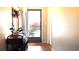 Bright foyer featuring hardwood floors, coat rack, and bench, leading to living spaces at 430 Heritage Dr, Danville, IN 46122