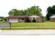 Charming single-story brick home with an attached garage, lush lawn and well-manicured landscaping at 430 Heritage Dr, Danville, IN 46122