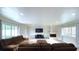Bright living room featuring a large fireplace, recessed lighting and a large sectional sofa at 430 Heritage Dr, Danville, IN 46122