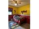 Whimsical bedroom featuring bright colors, Mickey Mouse decor, and a cozy bed at 4928 Dancer Dr, Indianapolis, IN 46237