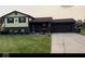 Charming two-story home with brick and siding exterior, and a well-manicured lawn and driveway at 4928 Dancer Dr, Indianapolis, IN 46237