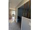 Hallway leading to a dining area with hard wood flooring and traditional style furnishings at 4928 Dancer Dr, Indianapolis, IN 46237