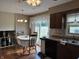 Kitchen featuring a dining nook with hard wood flooring, a window, and stainless steel appliances at 4928 Dancer Dr, Indianapolis, IN 46237