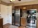 Kitchen featuring stainless steel appliances, hard wood flooring, and plenty of storage space at 4928 Dancer Dr, Indianapolis, IN 46237