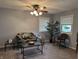 Relaxing living room has a ceiling fan and features large windows for plenty of natural light at 4928 Dancer Dr, Indianapolis, IN 46237