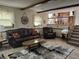 Comfortable living room with neutral-toned tile flooring, with an attached dining and kitchen area at 4928 Dancer Dr, Indianapolis, IN 46237